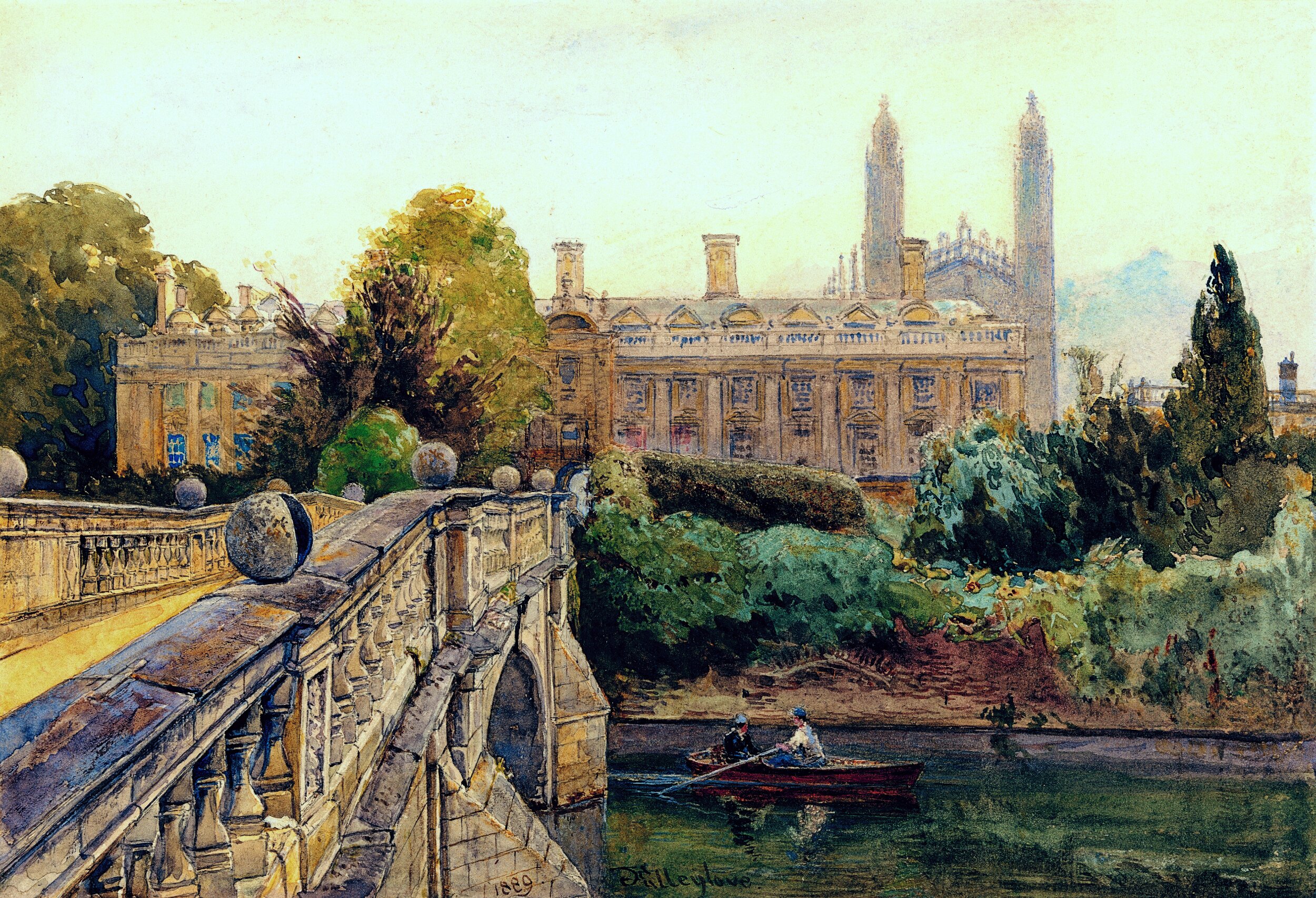 A watercolor landscape painting depicting a serene, classical scene. In the foreground on the left, a stone bridge with an ornate balustrade, large spherical ornaments on pedestals, and a visible arch is bathed in sunlight. The bridge angles diagonally down towards a dark, calm river. On the water, a small red rowboat carries two figures, one rowing with an oar while the other sits facing them, casting reflections in the water. There's dense, lush green trees and thick foliage that partially obscure the base of a building. The background features a symmetrical classical structure with arched windows, tall chimneys, and two towering gothic spires. The sky is a soft, hazy pale yellow-blue. In the bottom left corner on the stone wall of the bridge, the year '1889' and an artist's signature are visible.
