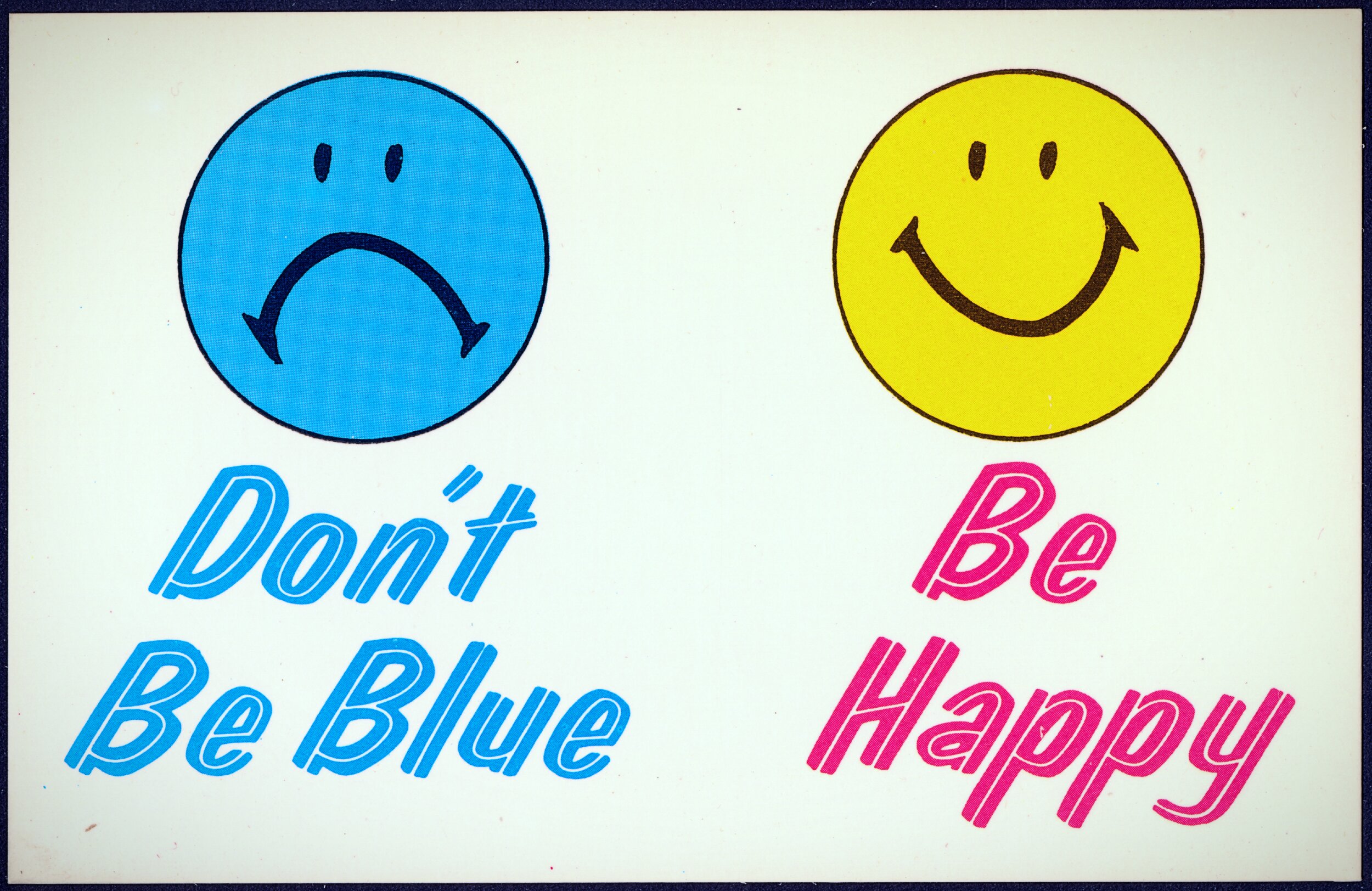 Retro postcard with a cream background. On the left, a blue circle with a frowning face sits above light blue cursive text reading 'Don't Be Blue.' On the right, a yellow circle with a smiling face sits above pink cursive text reading 'Be Happy.'