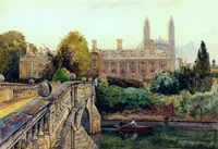 A watercolor landscape painting depicting a serene, classical scene. In the foreground on the left, a stone bridge with an ornate balustrade, large spherical ornaments on pedestals, and a visible arch is bathed in sunlight. The bridge angles diagonally down towards a dark, calm river. On the water, a small red rowboat carries two figures, one rowing with an oar while the other sits facing them, casting reflections in the water. There's dense, lush green trees and thick foliage that partially obscure the base of a building. The background features a symmetrical classical structure with arched windows, tall chimneys, and two towering gothic spires. The sky is a soft, hazy pale yellow-blue. In the bottom left corner on the stone wall of the bridge, the year '1889' and an artist's signature are visible.
