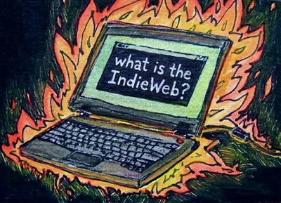 Artistic illustration in a sketchy style showing a laptop computer engulfed in vibrant orange and yellow flames against a dark green background. The laptop's screen displays the text 'what is the IndieWeb?' in white handwritten letters.