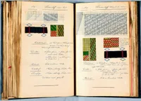 Two facing pages from an antique, worn leather-bound weaver's pattern book, handwritten in German with graph-paper (point-paper) weave charts. The left page, labeled 'No. 16, Hosenstoff, 65cm breit' (trouser fabric, 65cm wide), shows a small grid pattern and a dotted threading diagram above a black woven wool swatch with red accent threads and a woven color sample in green, yellow, and red. The right page, labeled 'No. 17, Hosenstoff, Warenbreite 120cm' (trouser fabric, 120cm wide), shows a denser grid pattern chart above two color swatches (a striped green/yellow pattern and a red/yellow/green diamond pattern) and another black wool swatch with red threads. Below each pattern, handwritten notes list technical specifications under headings including Blattstand (reed count), Dichte (density), Material, Zettelbrief (warp order), and Schussfolge (weft sequence).