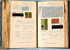 Two facing pages from an antique, worn leather-bound weaver's pattern book, handwritten in German with graph-paper (point-paper) weave charts. The left page, labeled 'No. 16, Hosenstoff, 65cm breit' (trouser fabric, 65cm wide), shows a small grid pattern and a dotted threading diagram above a black woven wool swatch with red accent threads and a woven color sample in green, yellow, and red. The right page, labeled 'No. 17, Hosenstoff, Warenbreite 120cm' (trouser fabric, 120cm wide), shows a denser grid pattern chart above two color swatches (a striped green/yellow pattern and a red/yellow/green diamond pattern) and another black wool swatch with red threads. Below each pattern, handwritten notes list technical specifications under headings including Blattstand (reed count), Dichte (density), Material, Zettelbrief (warp order), and Schussfolge (weft sequence).