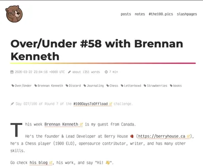 Screenshot of a minimalist blog post titled 'Over/Under #58 with Brennan Kenneth,' featuring a large bold headline with a rainbow underline, a small bear avatar in the top left, navigation links ('posts,' 'notes,' '#the100.pics,' 'slashpages') in the top right, and metadata showing the date, word count (~1351 words), and 7-minute read time. Tags include Over/Under, Brennan Kenneth, Discord, Journaling, Chess, Letterboxd, Strawberries, and books. The excerpt introduces Brennan Kenneth as a Canadian founder and lead developer at Berry House, a 1900 ELO chess player, and an open-source contributor.