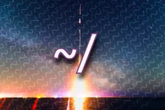 A rocket launches at night from a flat shoreline, its long-exposure trail streaking straight up through a star-filled sky with the Milky Way arching behind it. Orange, pink, and white light glows along the horizon and reflects on the water below. Over the center of the image, a large white '~/' with a purple outline sits on top of a faint repeating pattern of tilde characters that covers the sky.